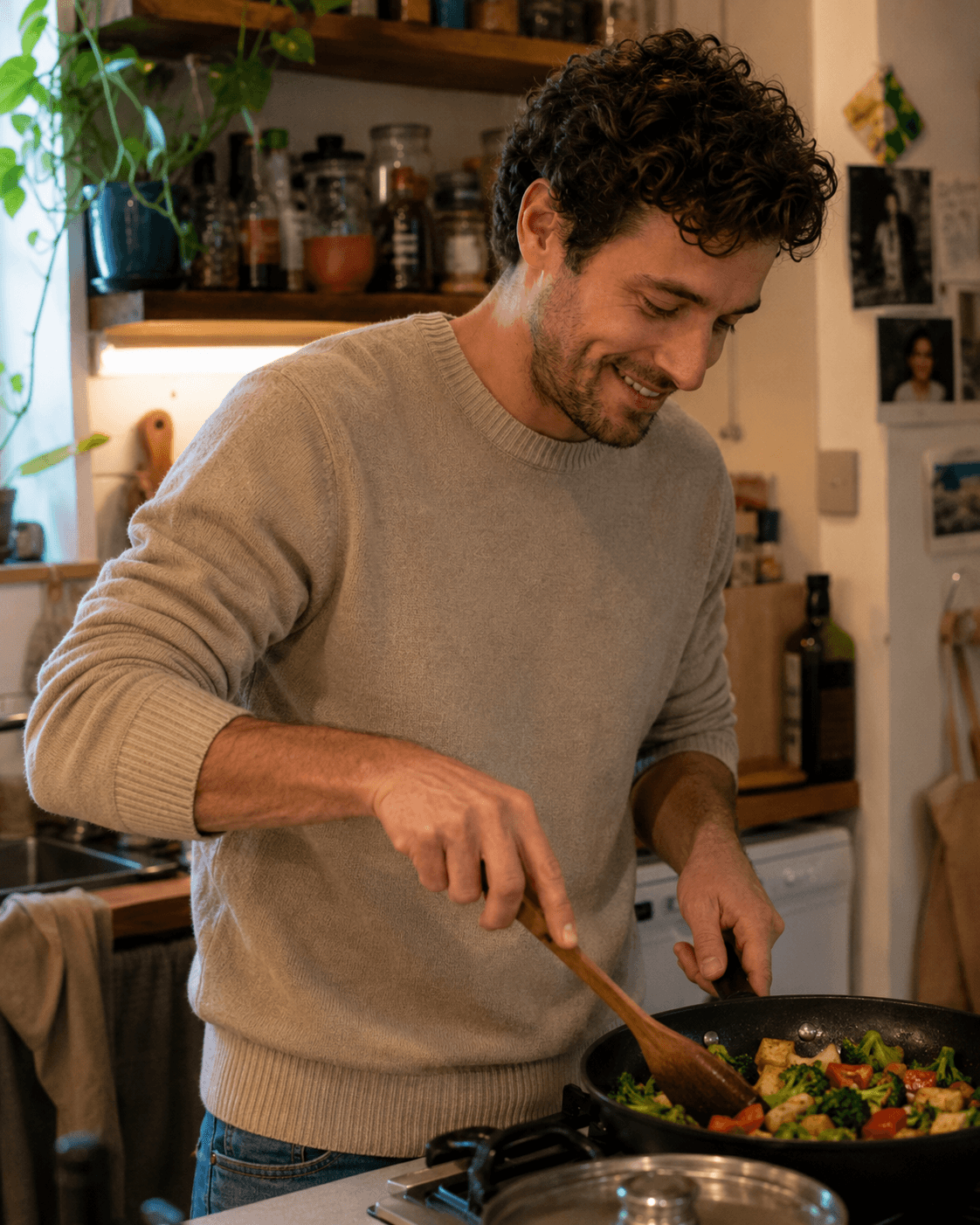 Man cooking vegetables in a home kitchen